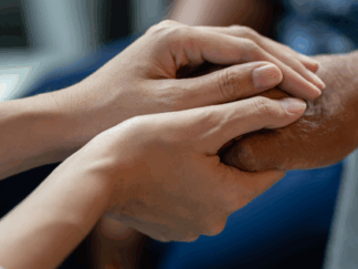 Two people holding hands.