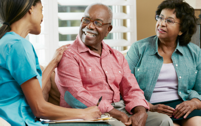 carer explaining our complex care services to a family